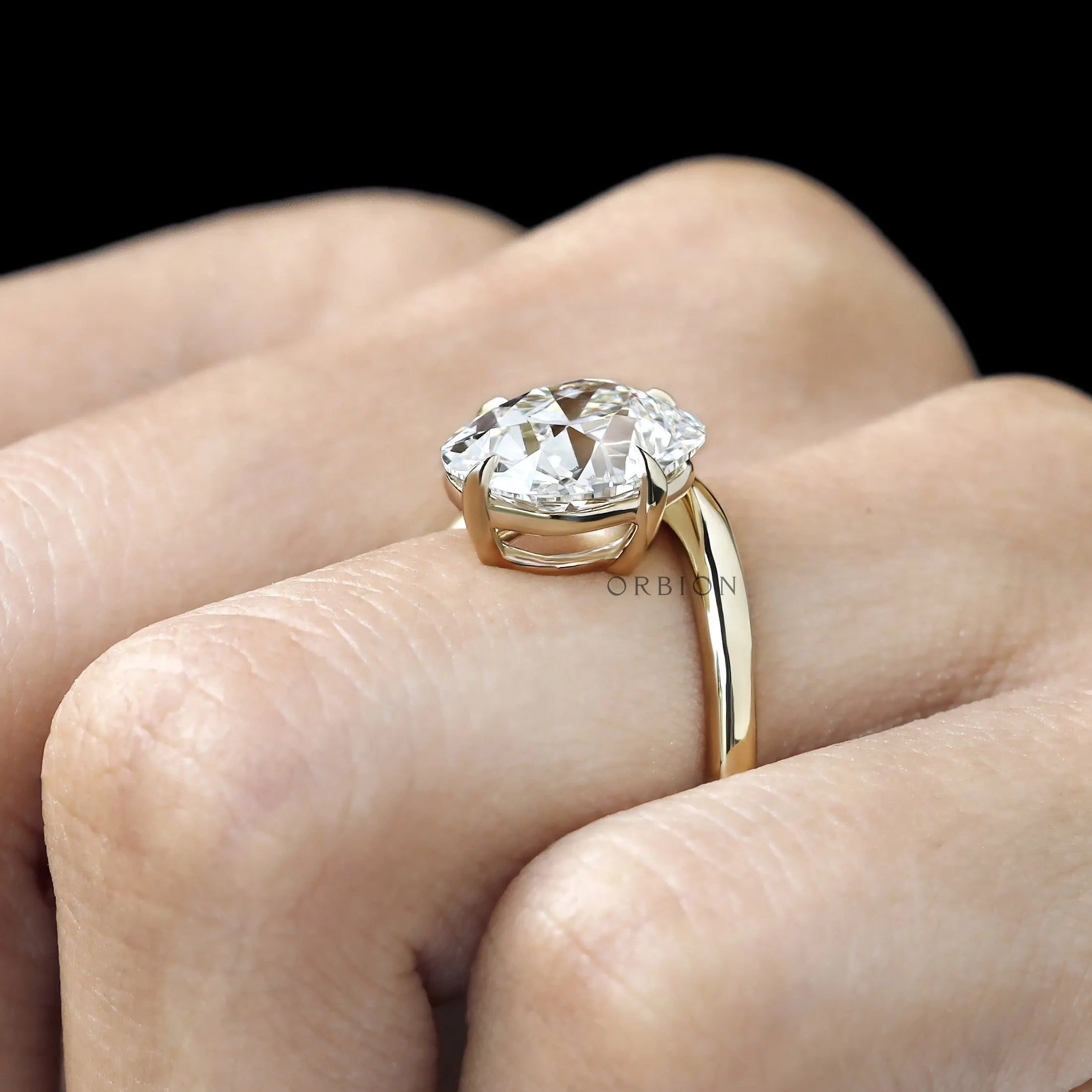 Curved 14k yellow gold bypass ring with old mine cushion lab diamond, compass setting