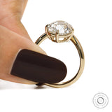 Yellow gold curved bypass ring showcasing old mine cushion lab diamond for engagement