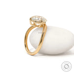 Curved bypass engagement ring with elongated cushion lab diamond in 14k yellow gold