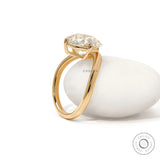 Curved bypass engagement ring with elongated cushion lab diamond in 14k yellow gold