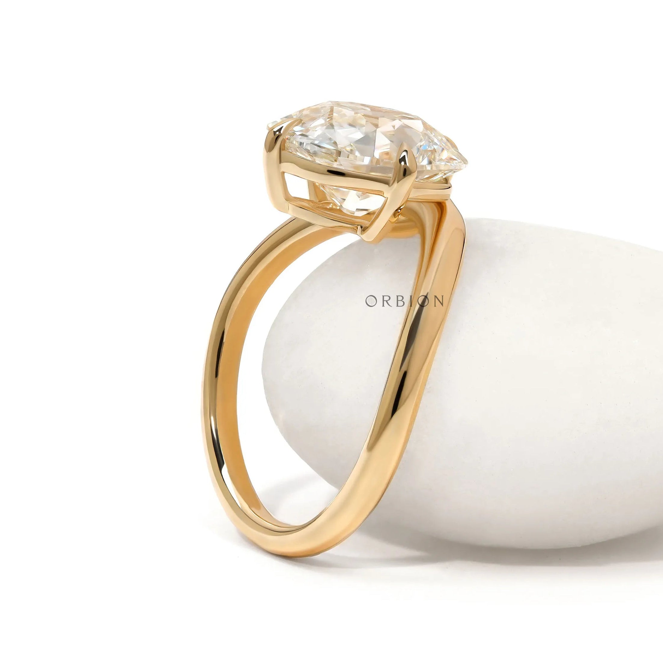 Curved bypass engagement ring with elongated cushion lab diamond in 14k yellow gold