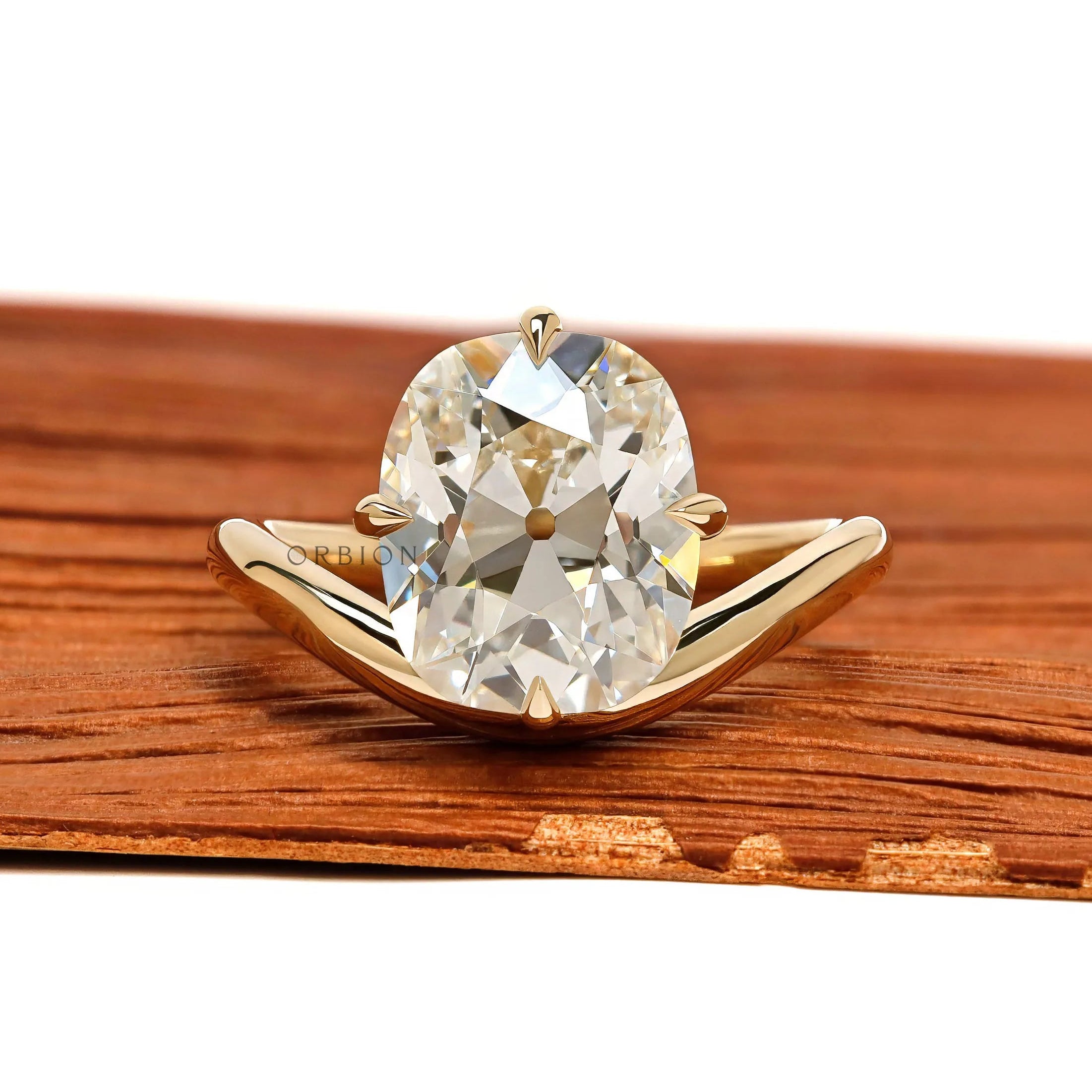 Curved elongated old mine cushion cut lab diamond ring with compass setting in 14k yellow gold