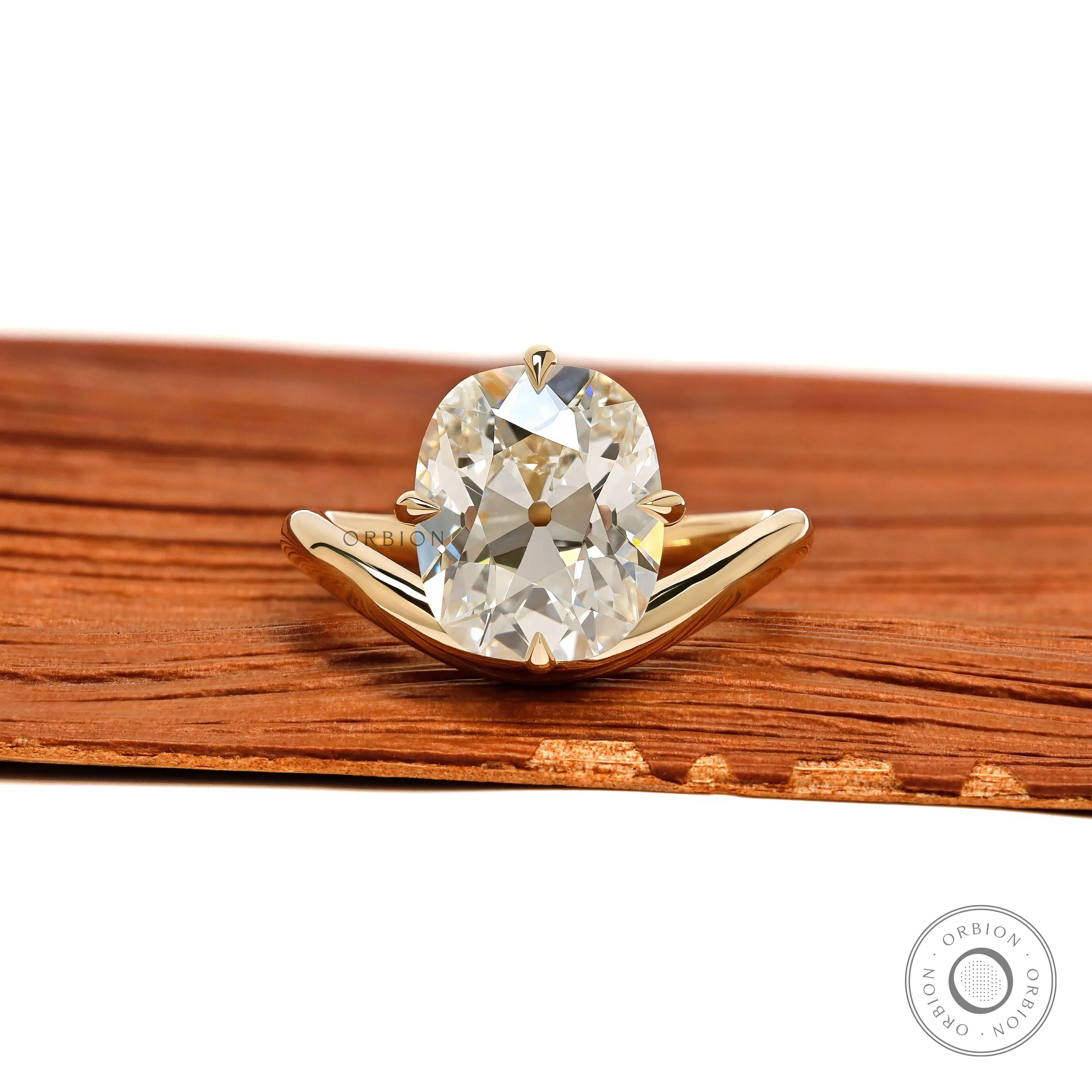 Curved elongated old mine cushion cut lab diamond ring with compass setting in 14k yellow gold