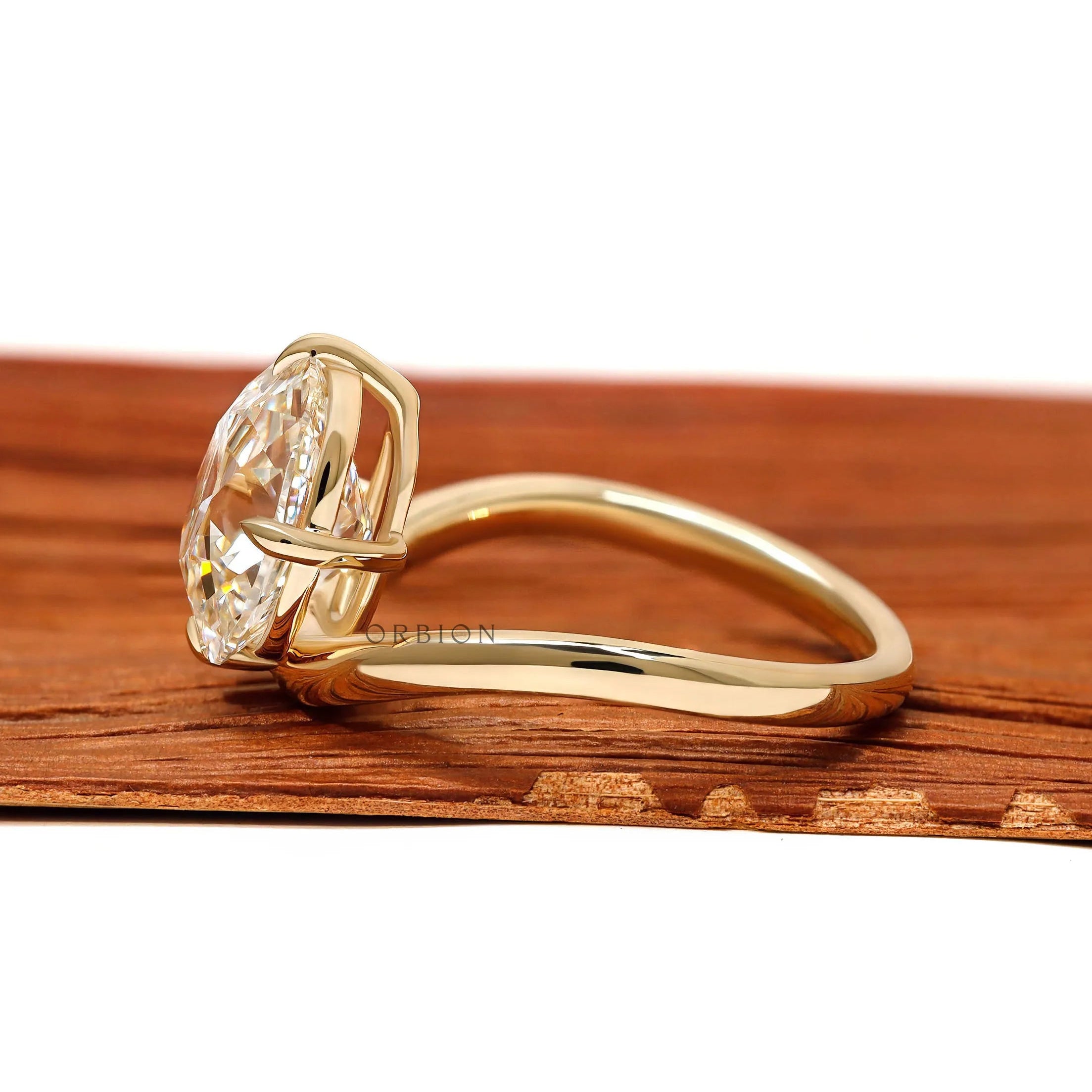 Elegant old mine cushion lab diamond ring in a curved bypass 14k yellow gold setting