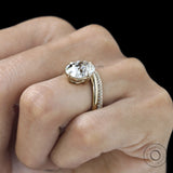 Yellow gold bridal set featuring curved cushion center stone