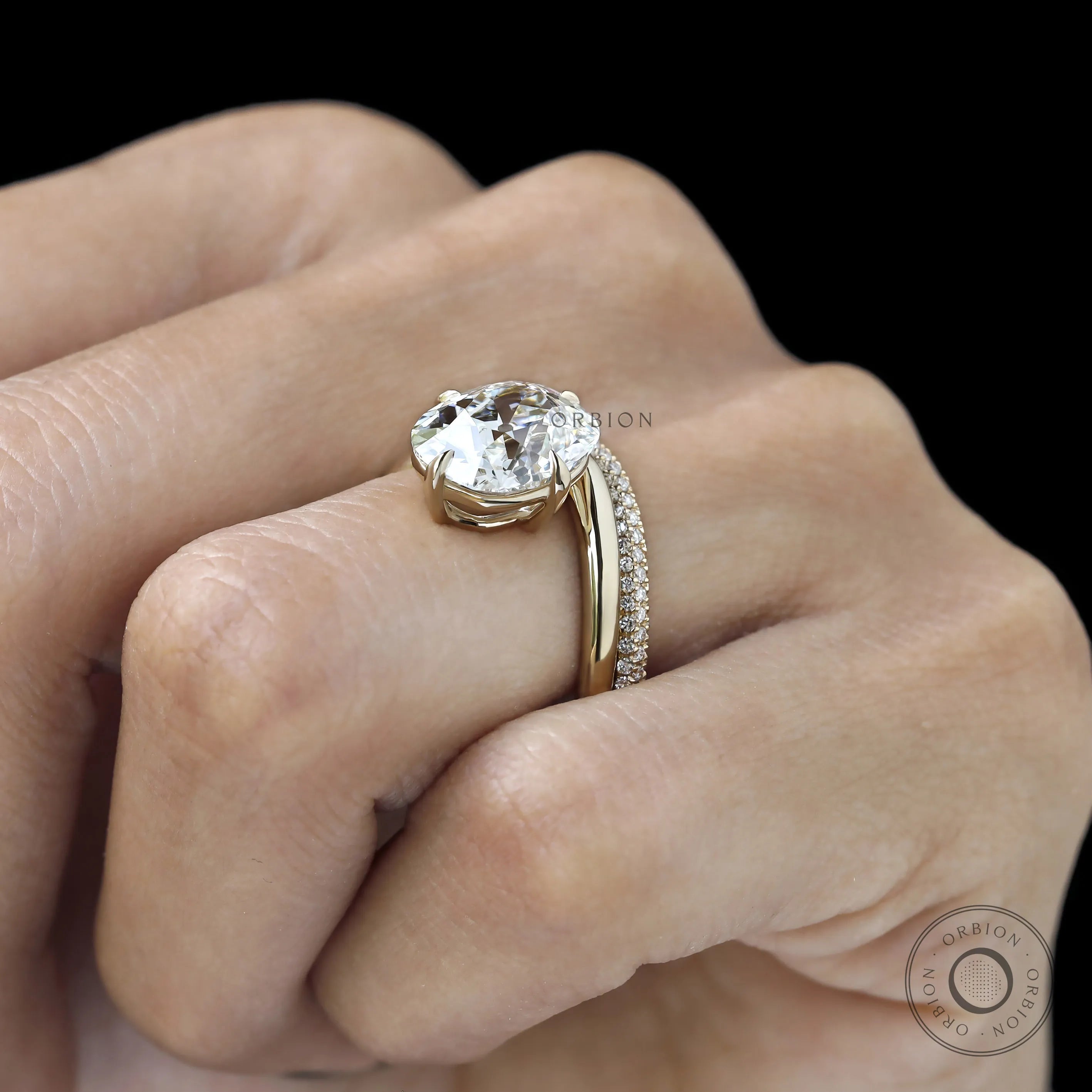 Yellow gold bridal set featuring curved cushion center stone