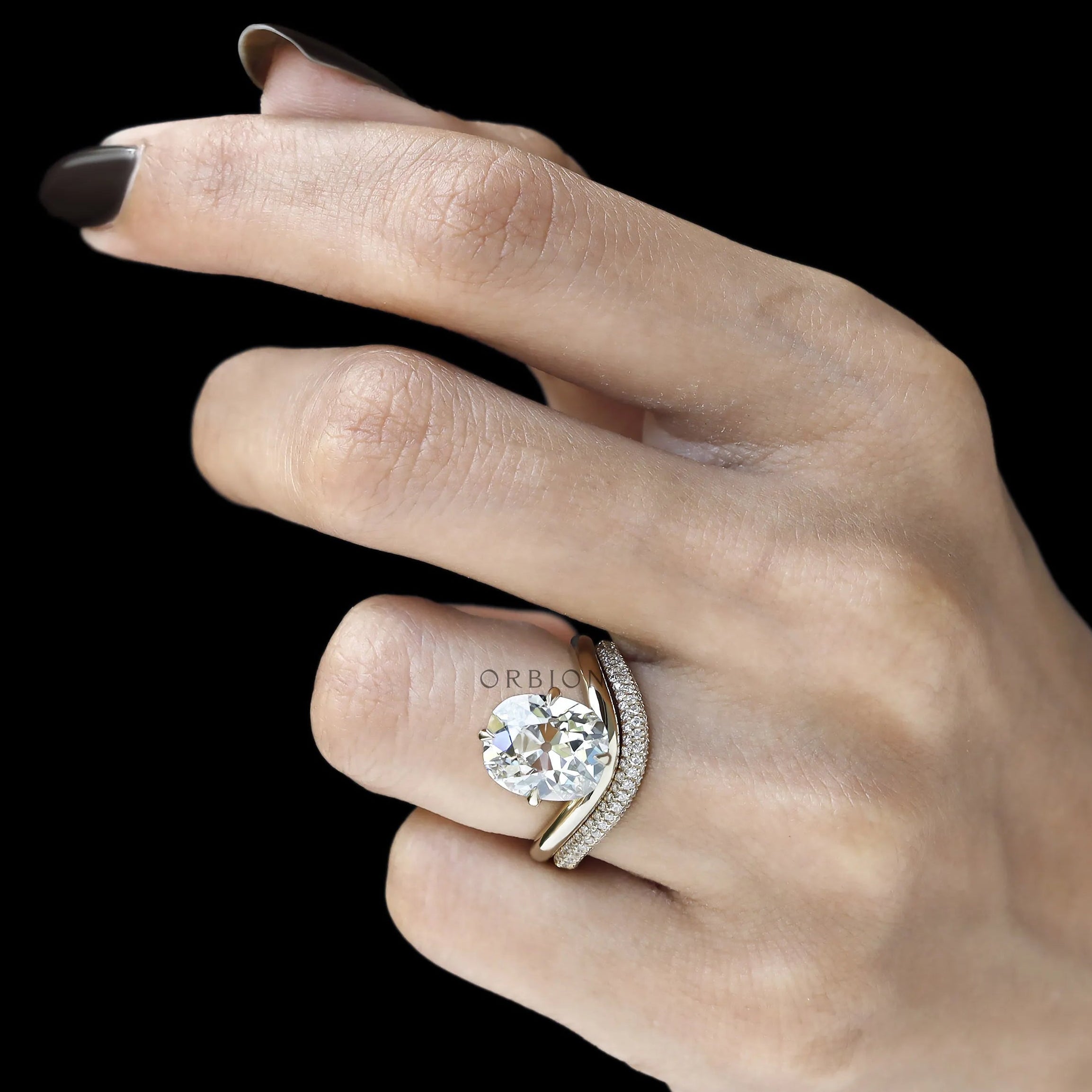 Curved elongated cushion lab diamond solitaire ring with matching pave diamond band