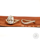 Modern engagement ring set with curved cushion center stone, old mine cut, 14k yellow gold