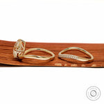Lab diamond or moissanite bridal ring set with compass setting and elongated cushion cut in yellow gold