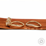 Lab diamond or moissanite bridal ring set with compass setting and elongated cushion cut in yellow gold