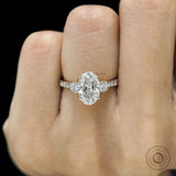 Cathedral style three stone engagement ring with oval lab grown diamond 