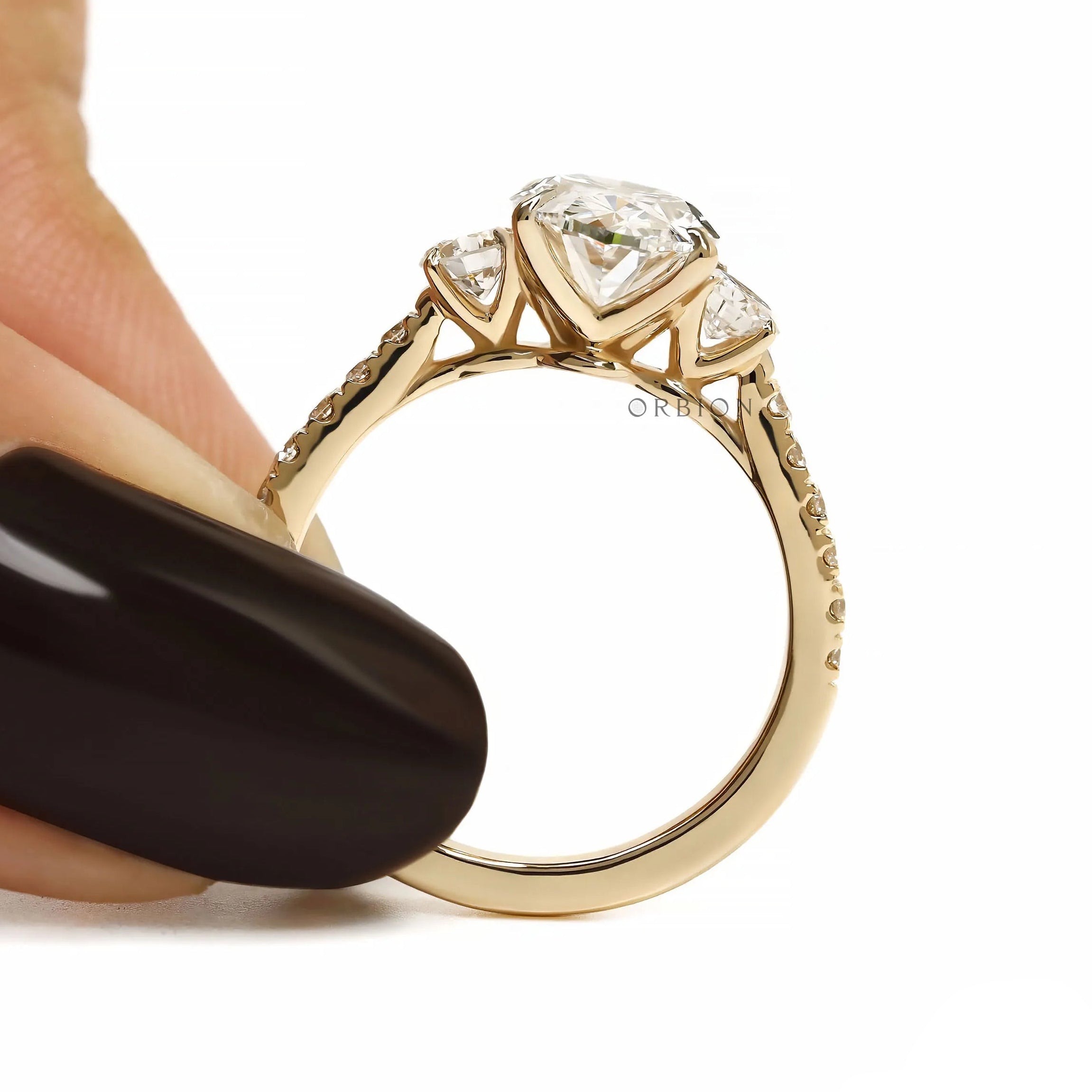 14k yellow gold engagement ring featuring oval lab grown diamond three stone design and pave shank