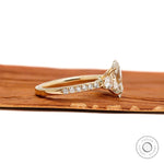 Elegant oval lab grown diamond three stone ring, cathedral band with pave shank, yellow gold