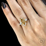 Marquise champagne moissanite engagement ring with tulip set, kite accents and three stones in 10k yellow gold