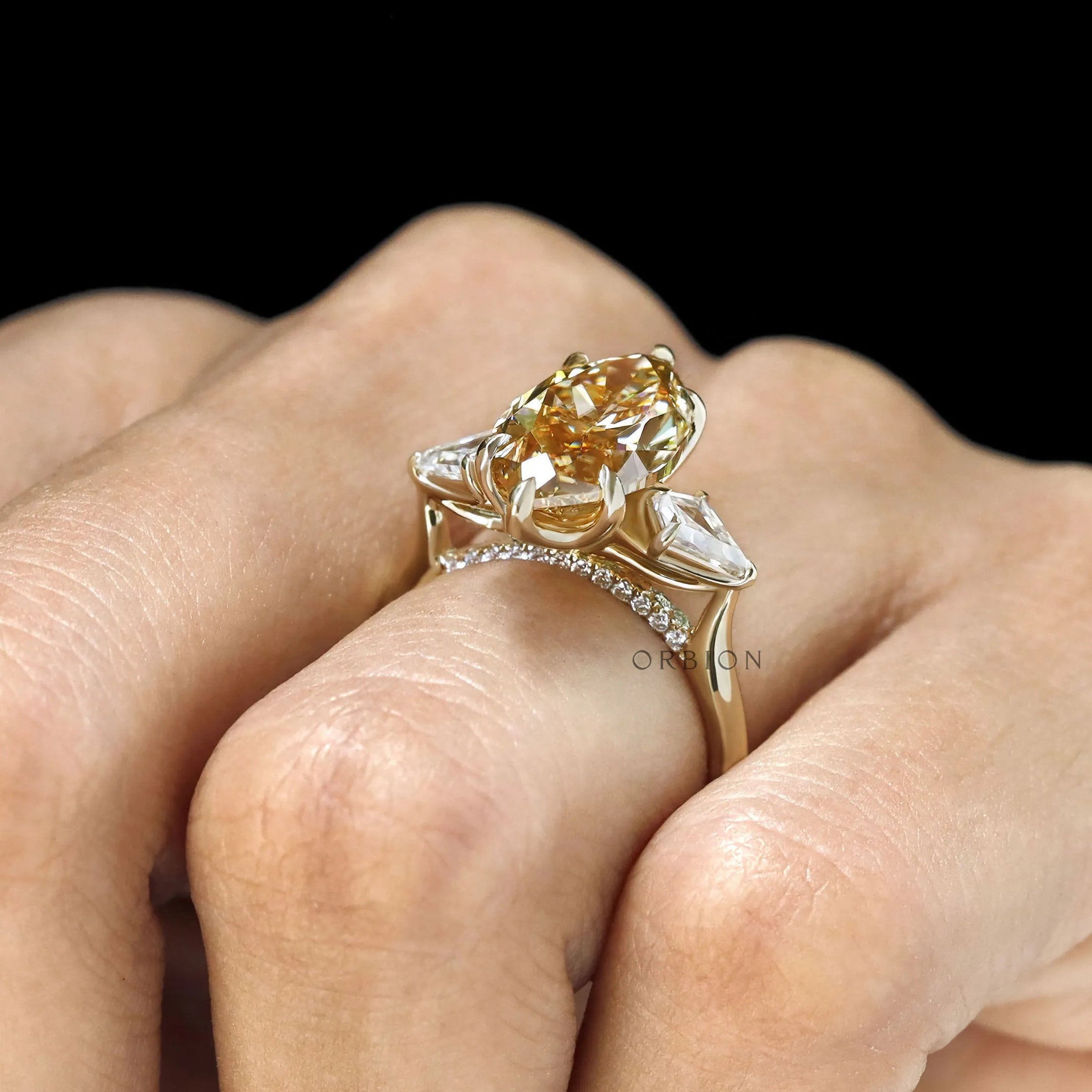 Tulip and kite set marquise moissanite three stone ring in 10k yellow gold, accented bridge design