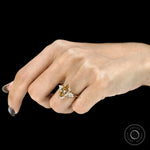 Champagne marquise three stone engagement ring with tulip setting and kite side stones in 10k yellow gold