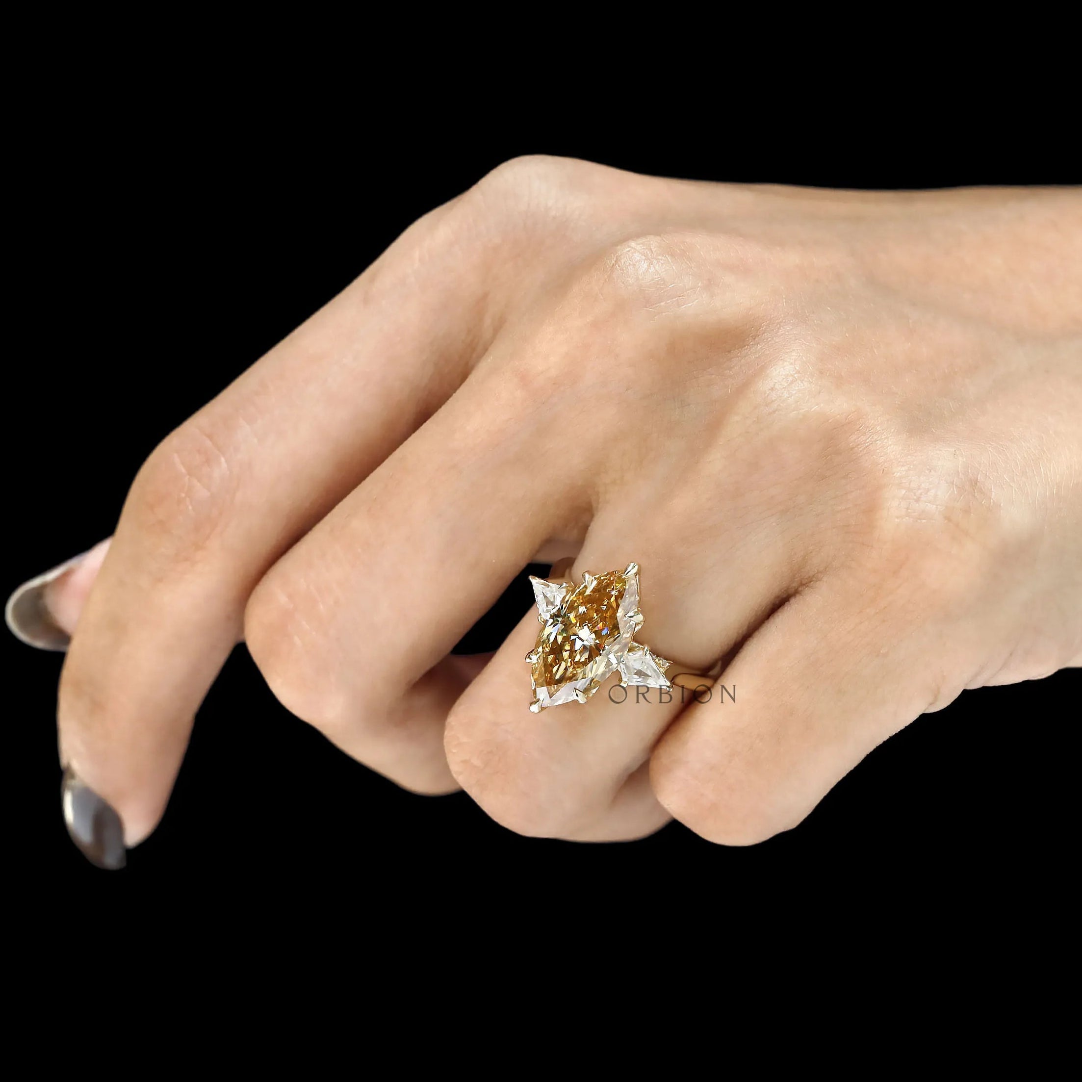 Champagne marquise three stone engagement ring with tulip setting and kite side stones in 10k yellow gold