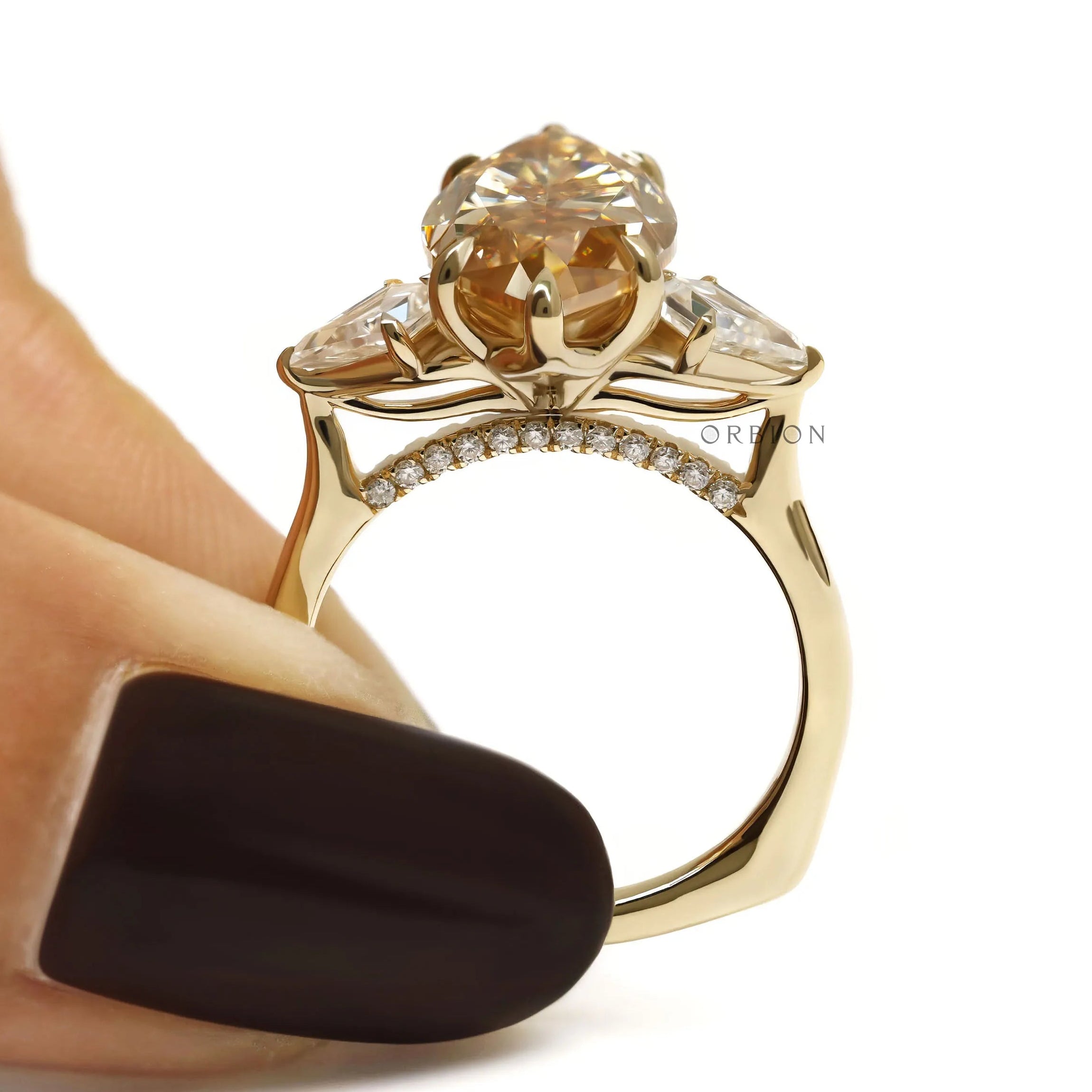 Tulip set marquise champagne moissanite three stone ring with kite side stones in 10k yellow gold