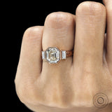 Elegant elongated asscher engagement ring with geometric baguette side stones in rose gold