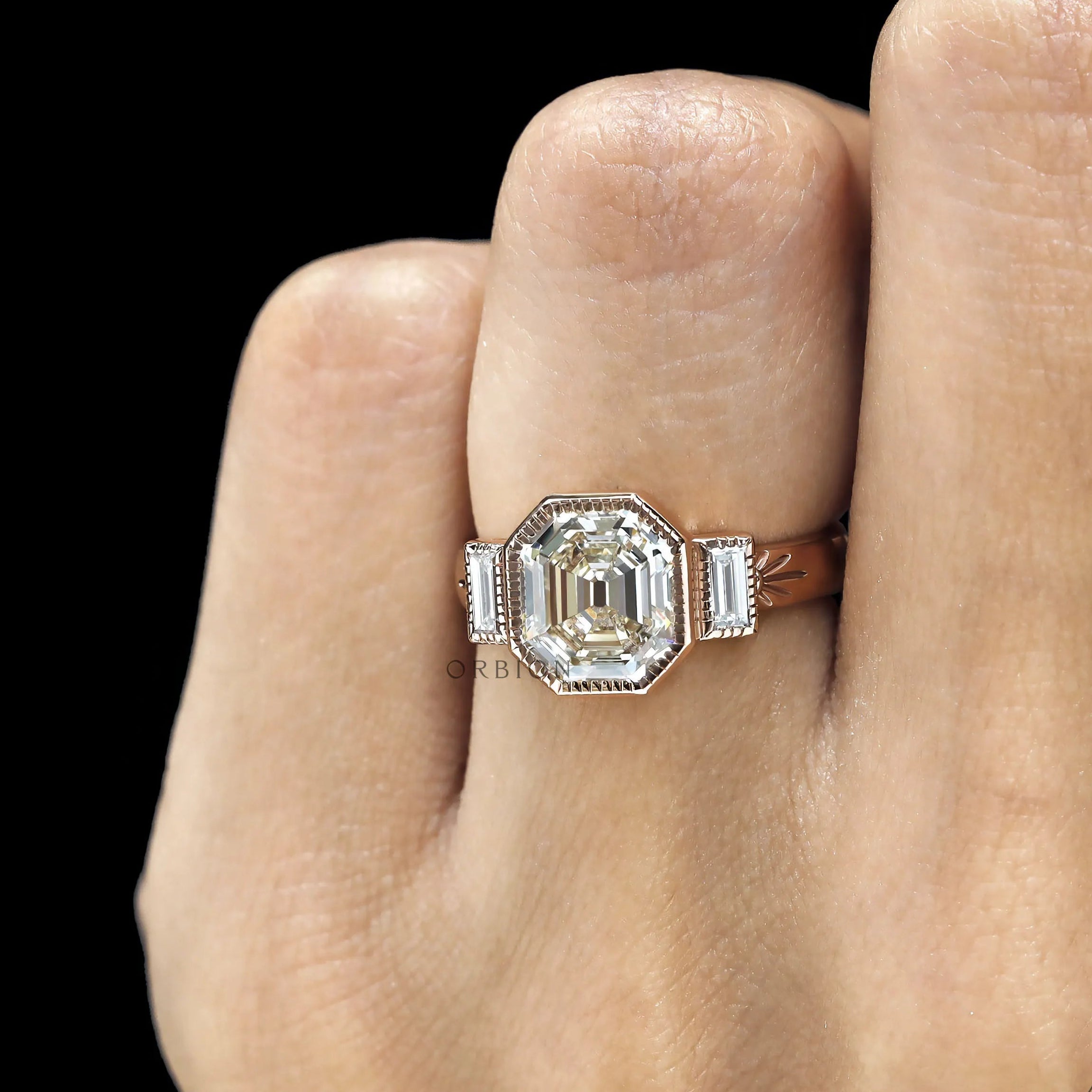 Elegant elongated asscher engagement ring with geometric baguette side stones in rose gold