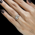 Rose gold art deco bridal ring featuring elongated asscher cut stone and baguette details
