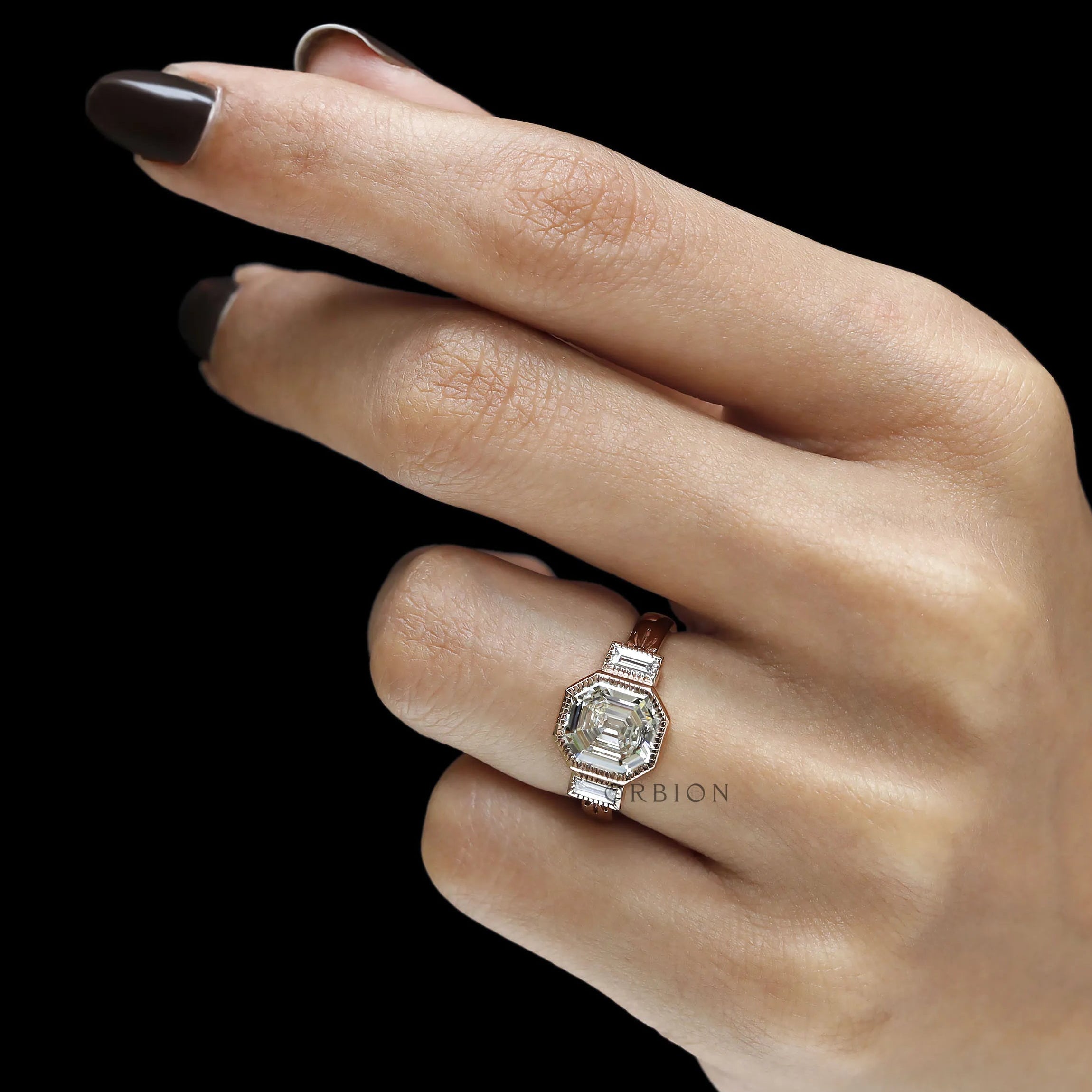 Geometric art deco engagement ring with asscher cut center and baguette accent stones