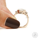 Vintage inspired asscher cut engagement ring with baguette diamonds in 18k rose gold
