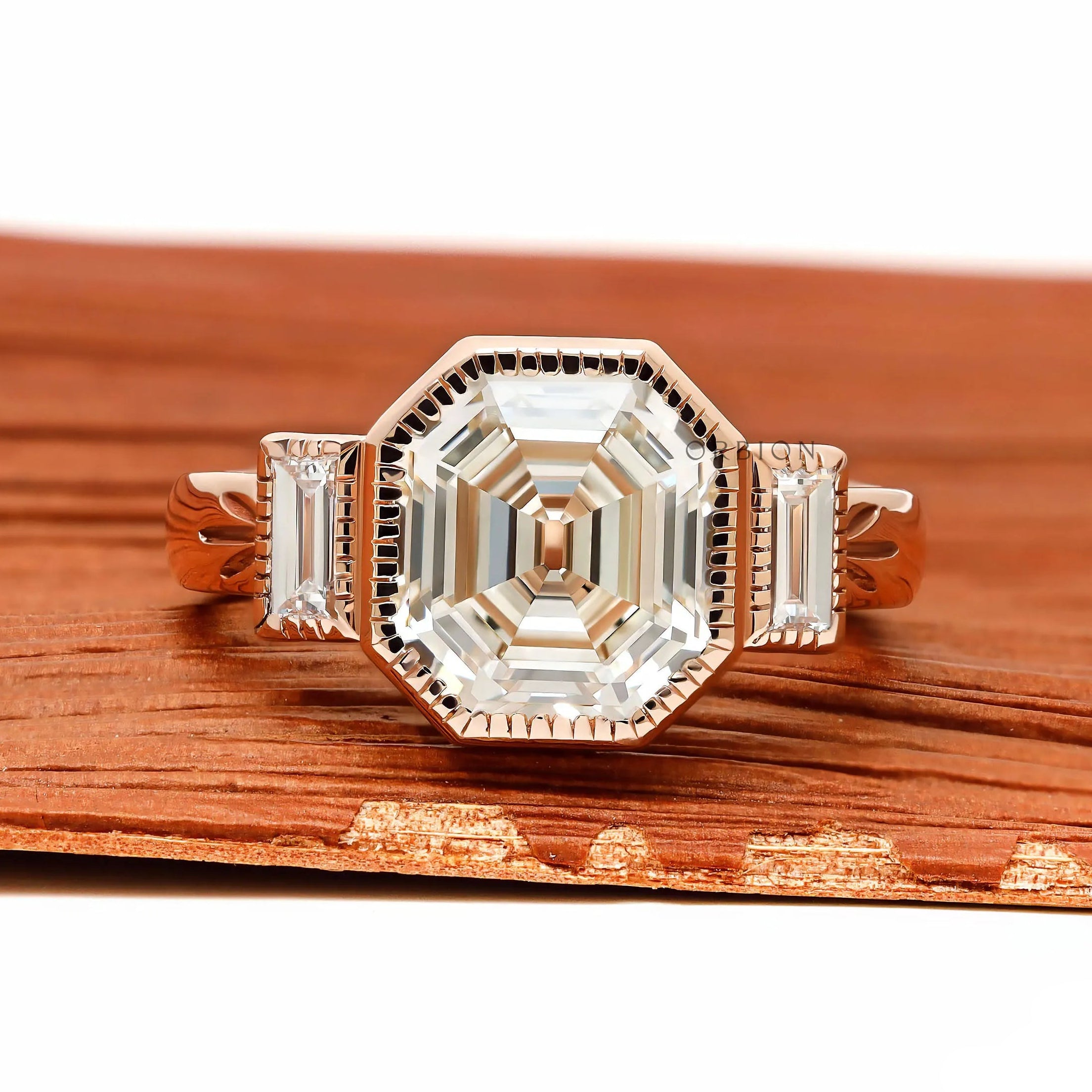 Elongated asscher cut three stone engagement ring with bezel set lab diamond or moissanite