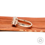 18k rose gold art deco engagement ring with elongated Asscher center and baguette side stones