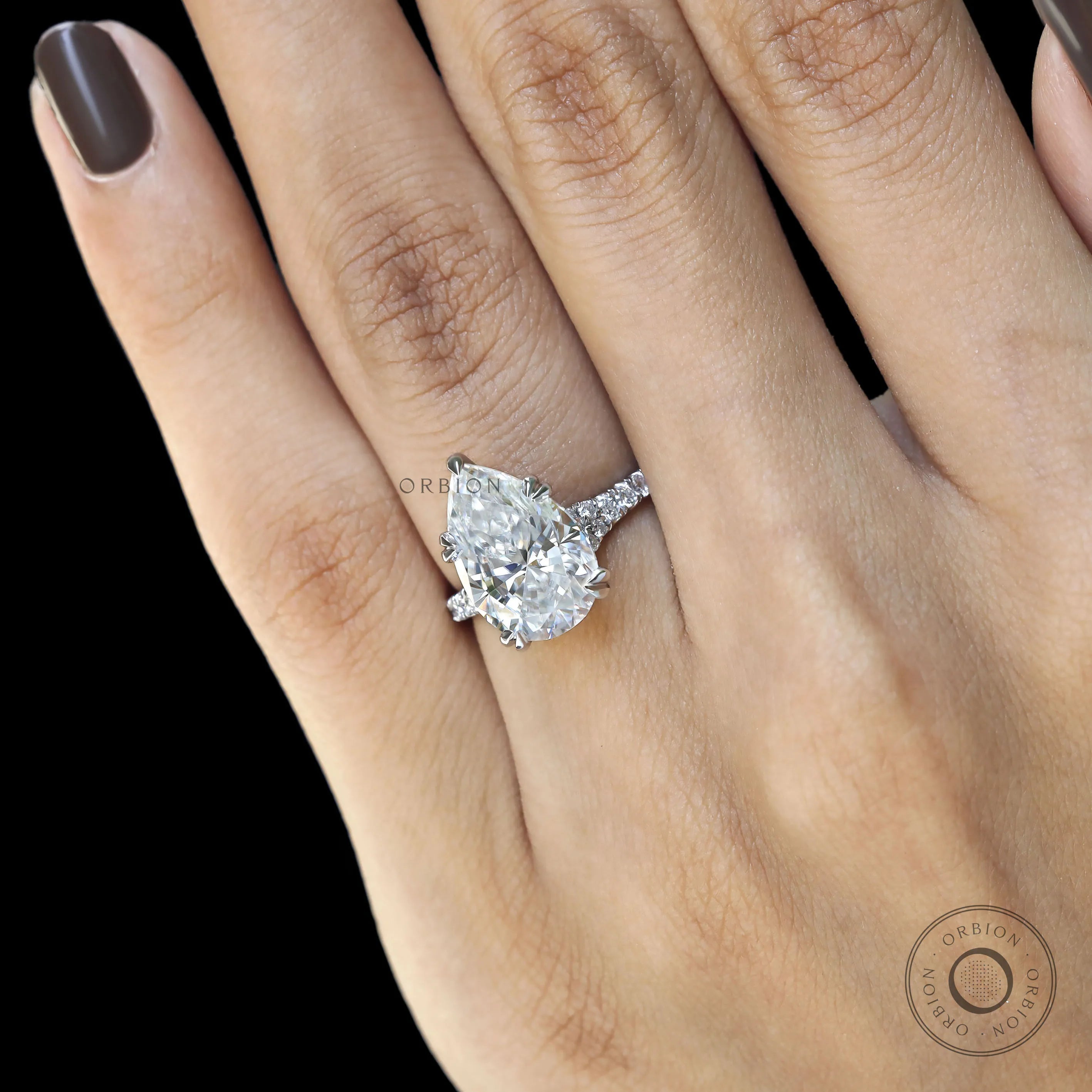 Statement pear engagement ring with cathedral setting and pave details