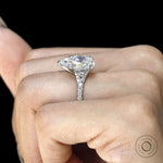 Brilliant pear shaped moissanite ring in polished white gold