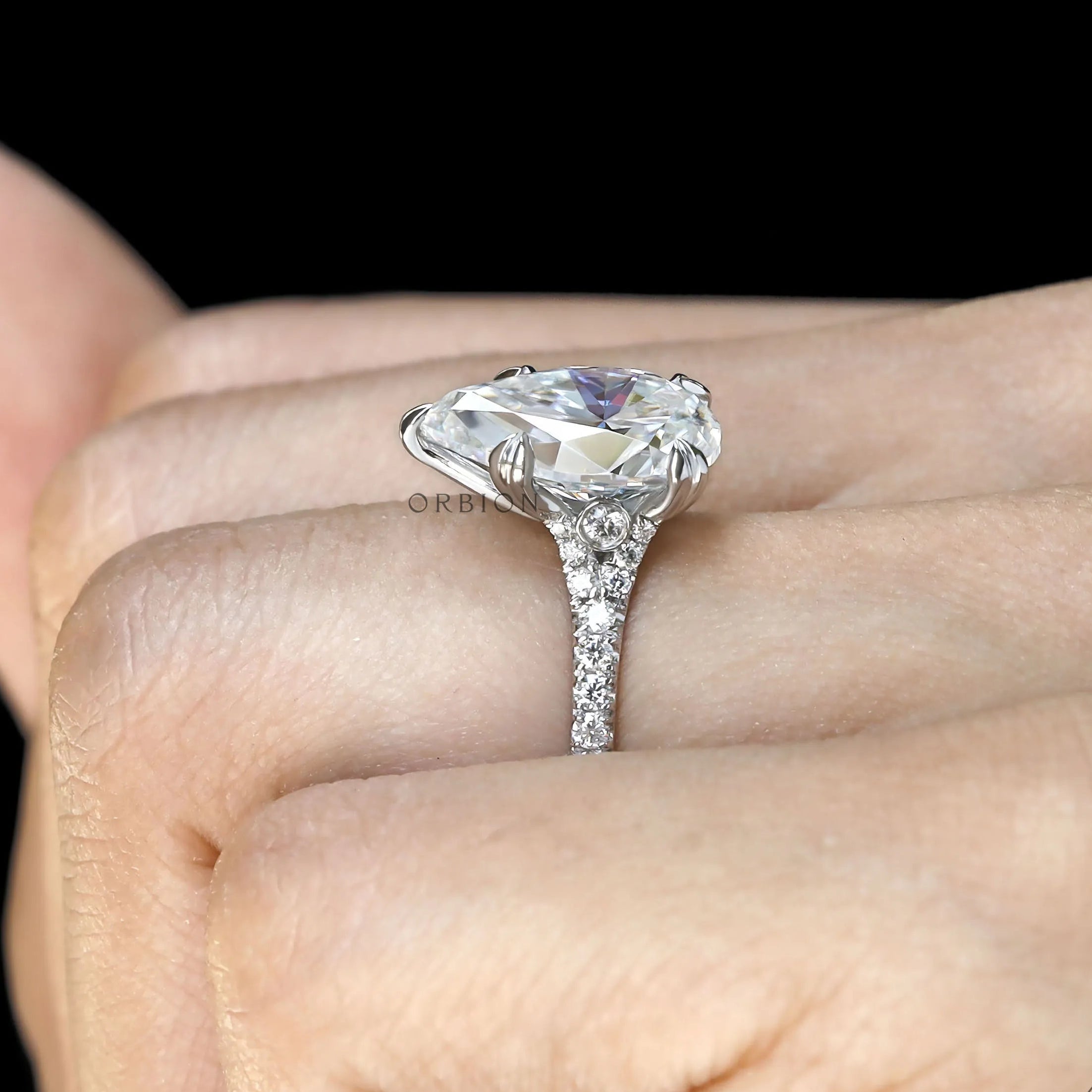 Brilliant pear shaped moissanite ring in polished white gold