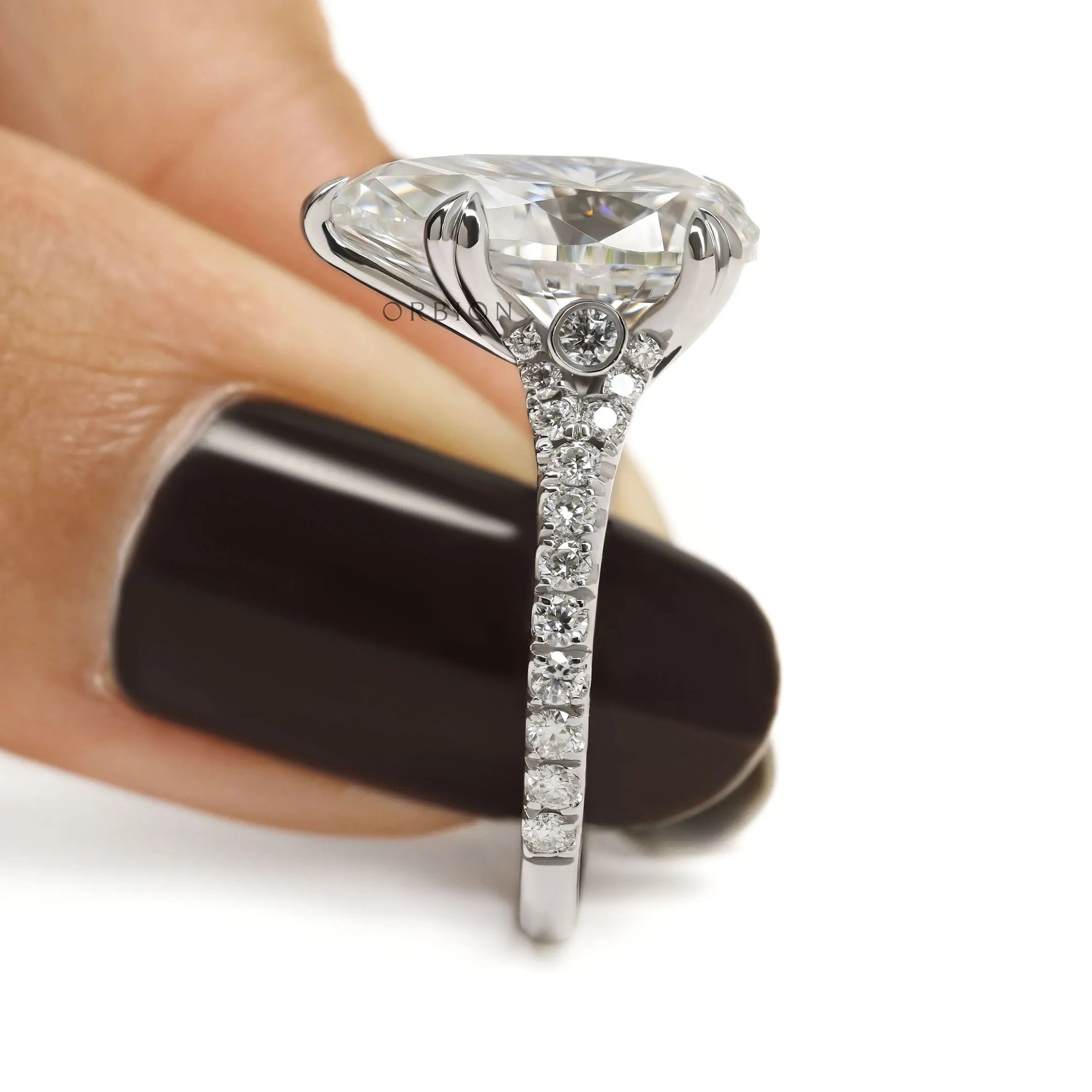 Elegant pear shaped solitaire ring in 10k white gold for women