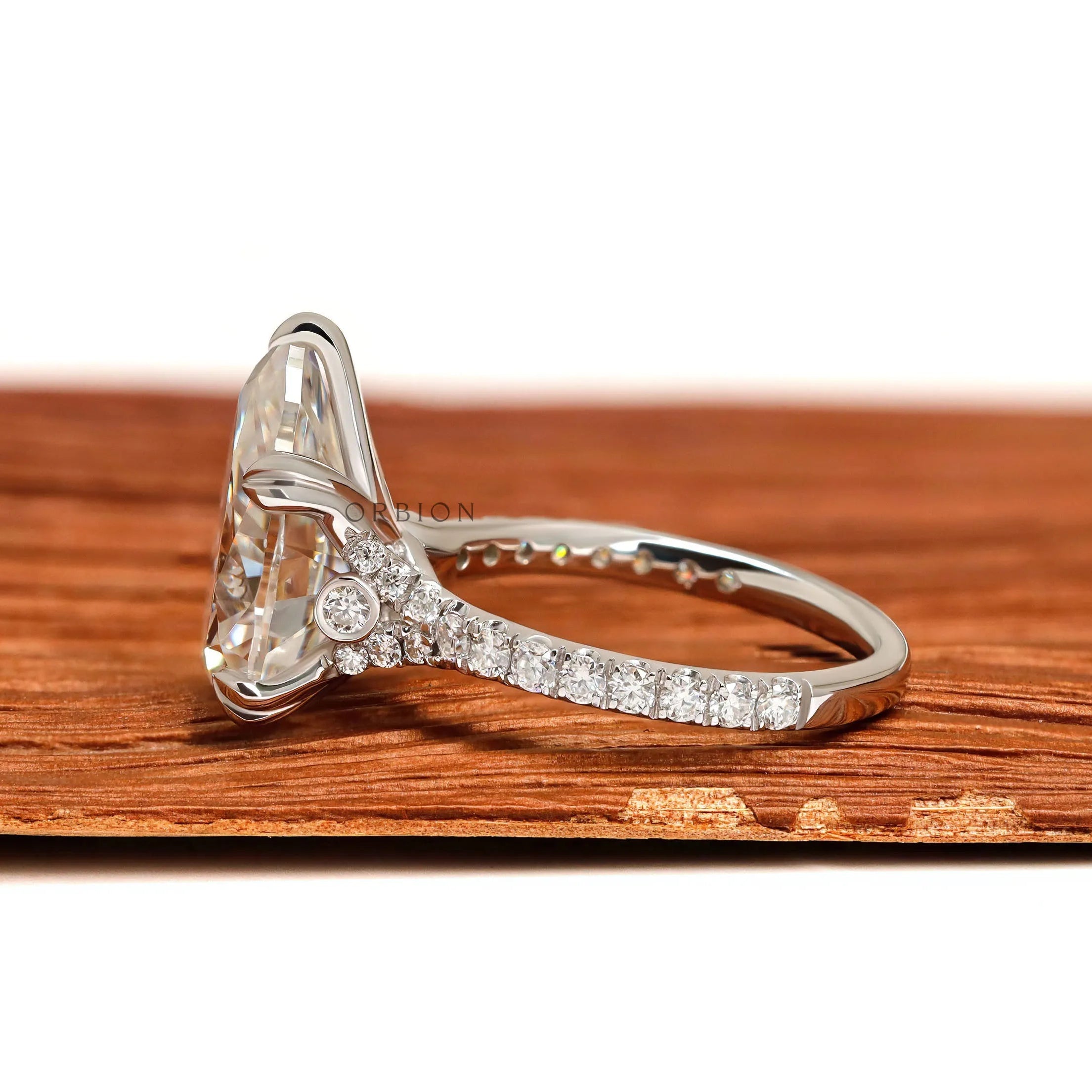 White gold pear solitaire engagement ring with split shank design
