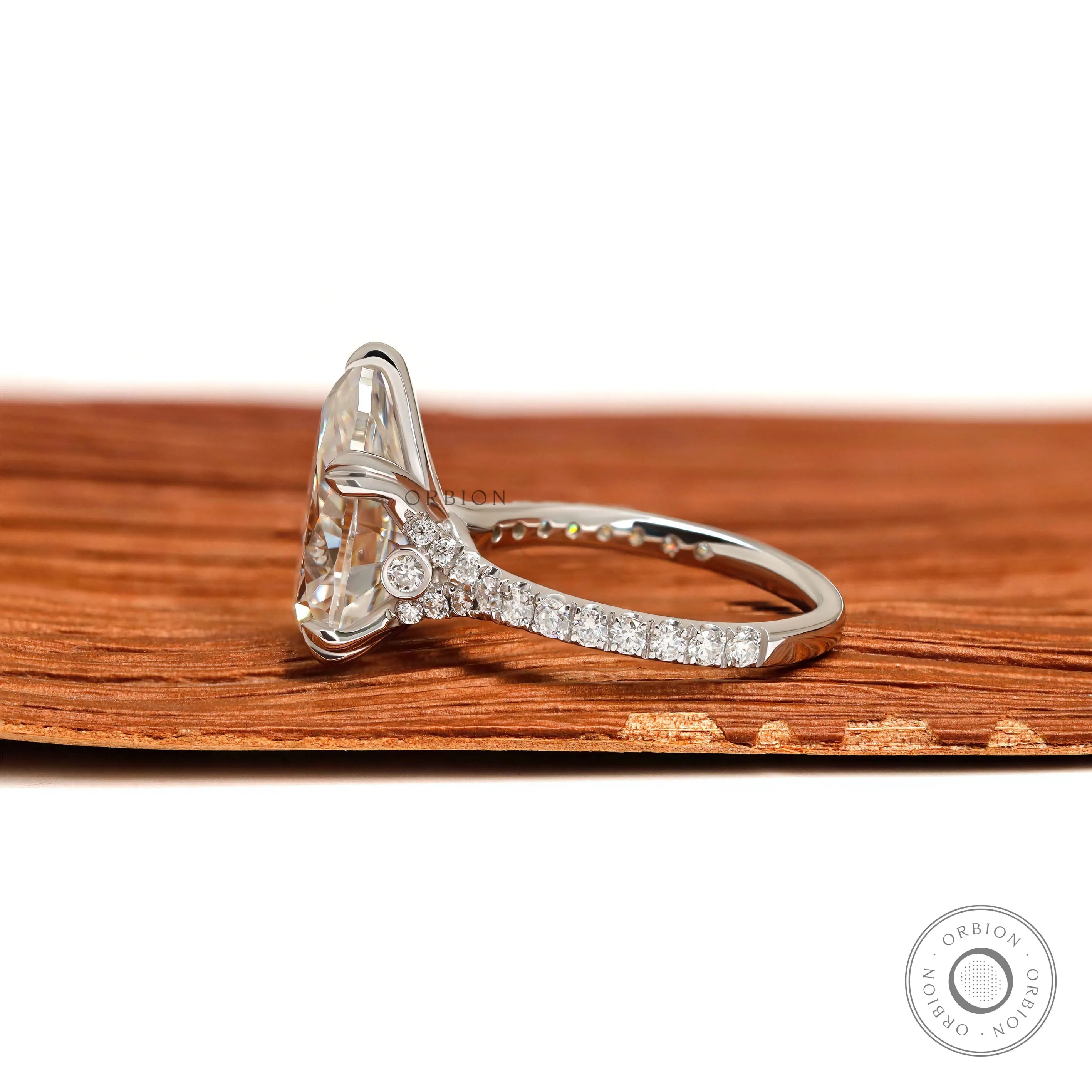 White gold pear solitaire engagement ring with split shank design