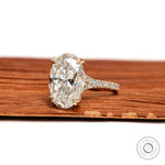 10k yellow gold cathedral ring with 5.50 CT oval moissanite or lab diamond solitaire, pavé split shank