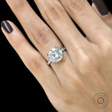 Elegant 10k white gold cathedral engagement ring with round moissanite and pave split shank