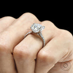 10k white gold cathedral ring with 10.5 MM round moissanite solitaire, pave set split shank
