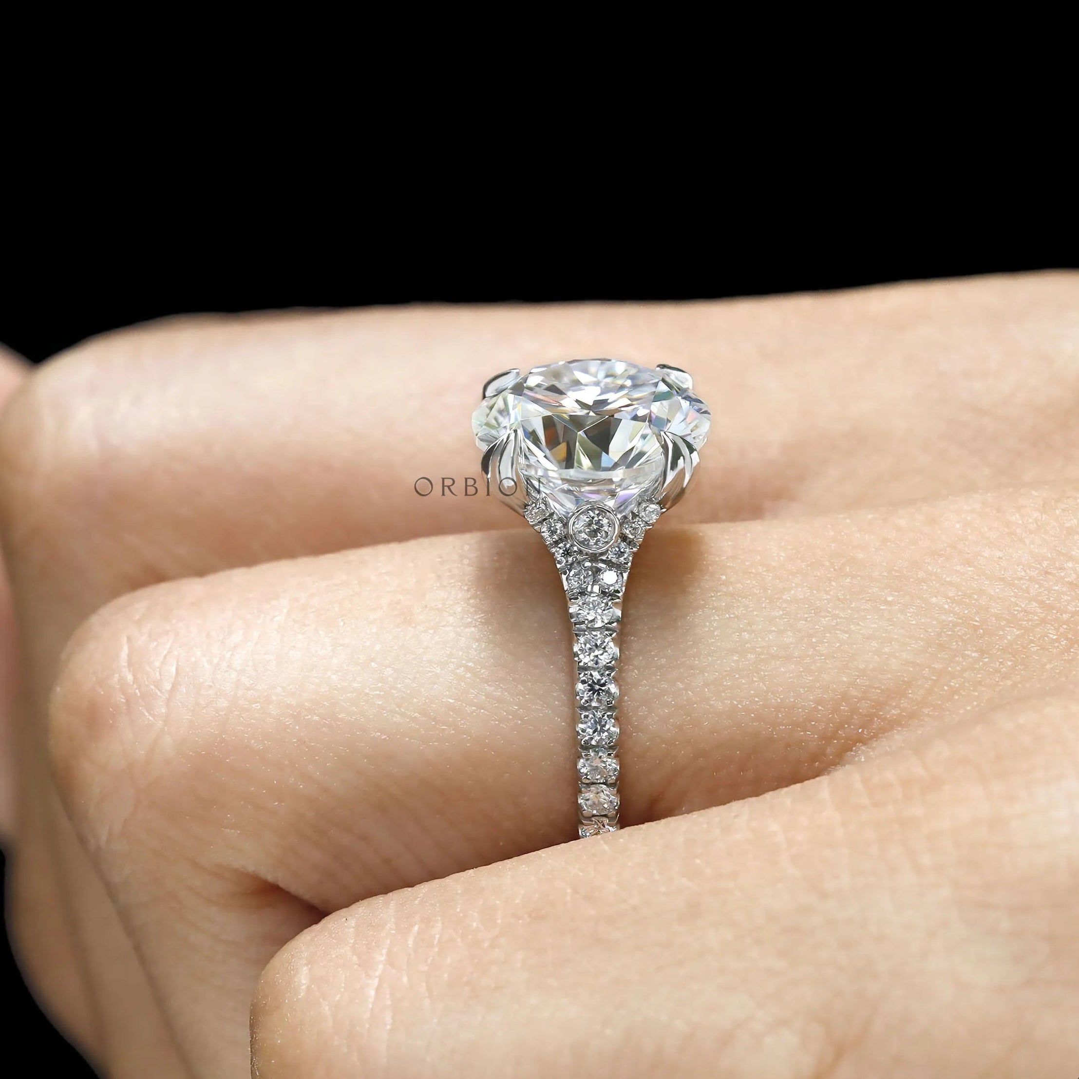 Round cut moissanite or lab diamond engagement ring, split shank cathedral band, 10k white gold