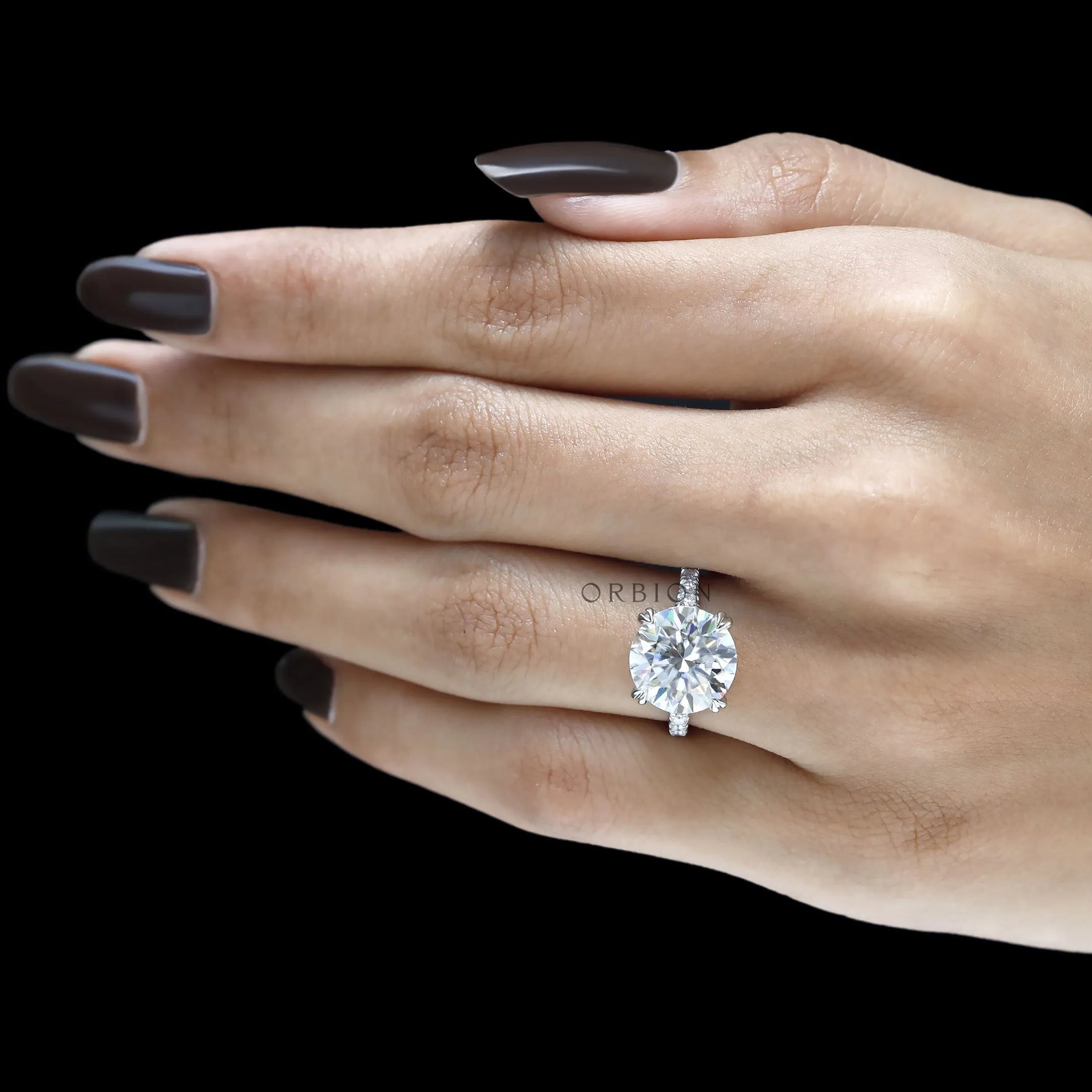 Cathedral split shank ring with 10.5 MM round moissanite solitaire, elegant 10k white gold