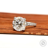 Elegant 4.7 CT round cut moissanite engagement ring in 10k white gold with pave split shank