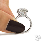 10k white gold engagement ring with 10.5 MM round moissanite solitaire, pave split shank, cathedral setting