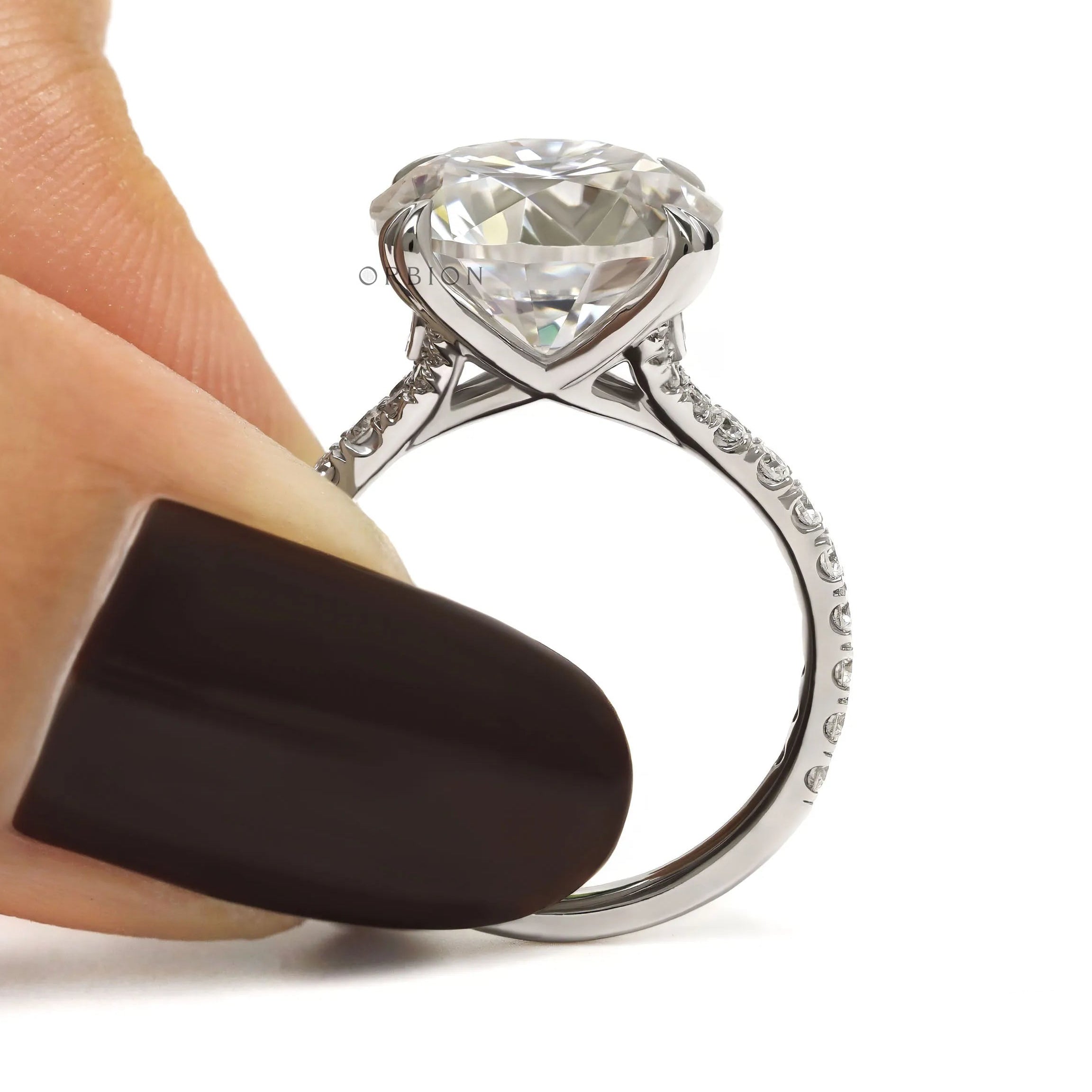 10k white gold engagement ring with 10.5 MM round moissanite solitaire, pave split shank, cathedral setting