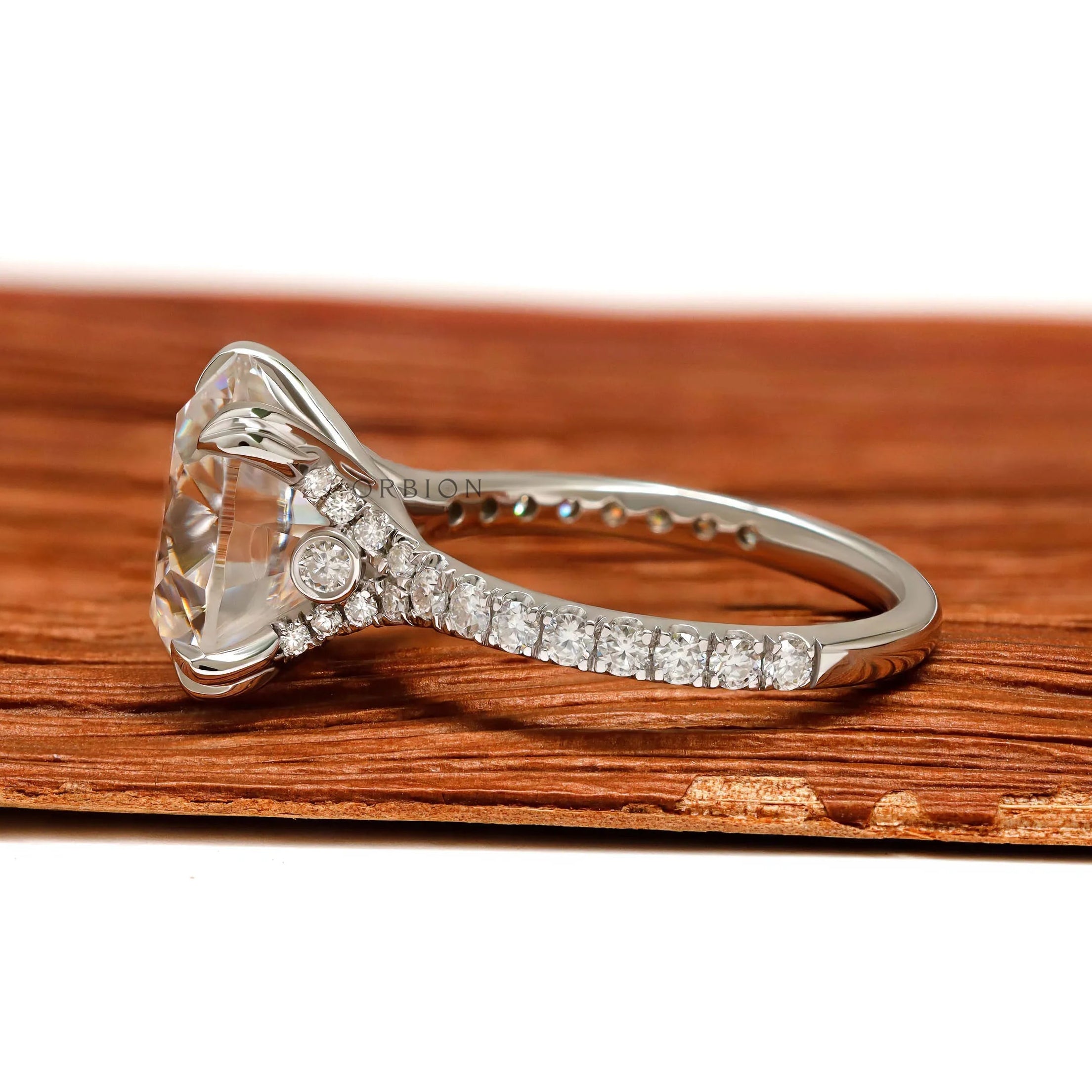 Cathedral engagement ring featuring large round moissanite solitaire, 10.5 MM, 10k white gold, split shank