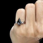 Modern gothic fine jewelry ring featuring black kite cut moissanite center stone