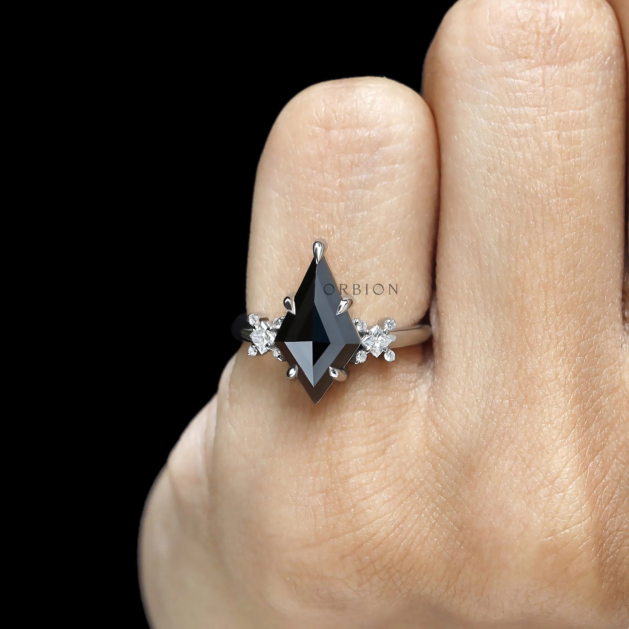 Modern gothic fine jewelry ring featuring black kite cut moissanite center stone