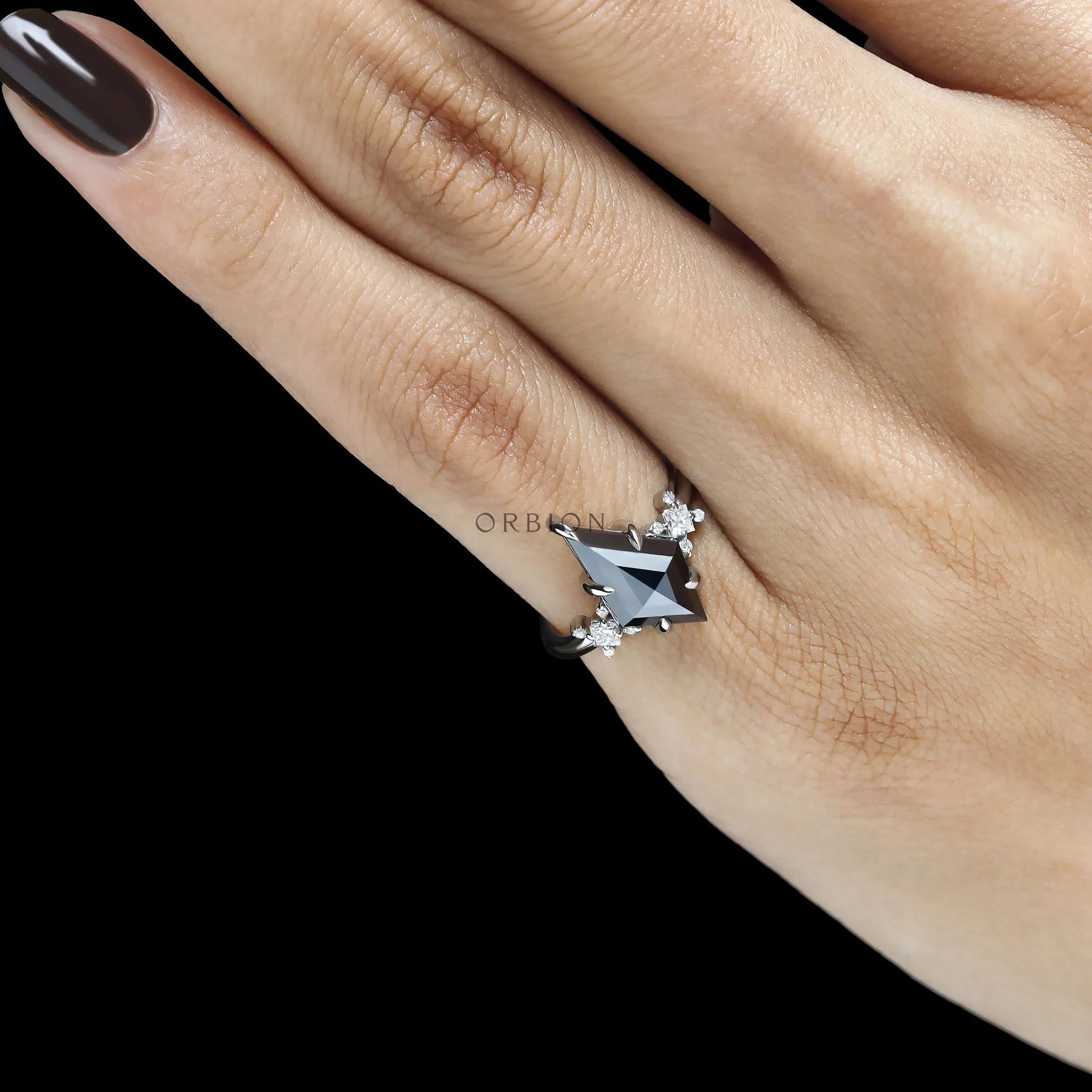 Statement black moissanite ring with 2 CT kite cut gemstone in a platinum cluster setting