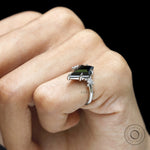 Engagement ring featuring black moissanite cluster setting in platinum 950 with geometric accents