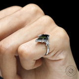 Engagement ring featuring black moissanite cluster setting in platinum 950 with geometric accents
