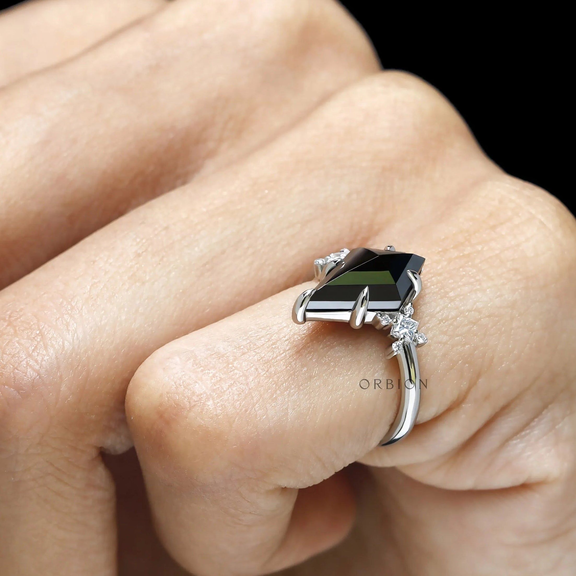 Engagement ring featuring black moissanite cluster setting in platinum 950 with geometric accents